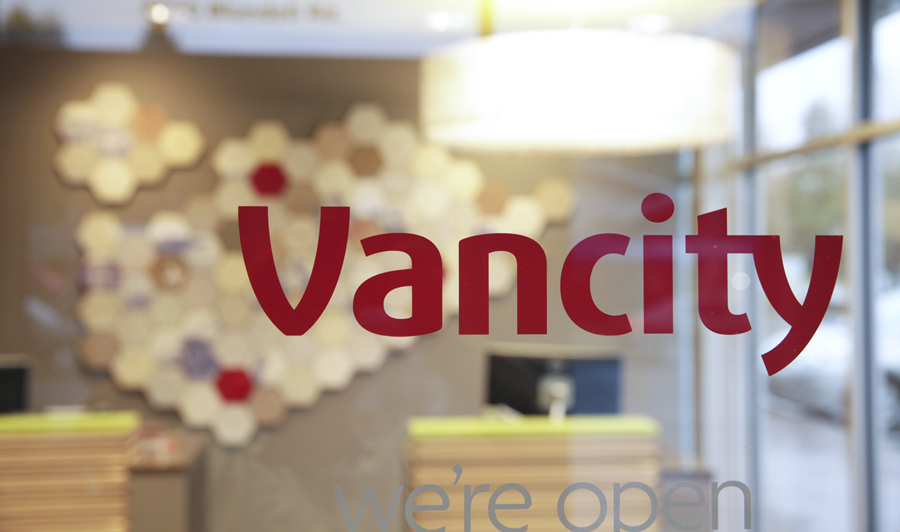 Re-Mapping an Island: Year: 2014
Materials: Moulded recycled paper, custom decals and ceramic tiles
We designed this mural for Vancity's new branch 88 in the abstracted form of the two islands that comprise the city of Richmond. The paper tiles for this project were made entirely from Vancity's recycled internal paper waste. On close inspection of the tiles, bits of Vancity's branding can still be made out. The accompanying ceramic tiles feature reworked blue and white images of Richmond's industrial roots and landmarks. Images curtesy of the Vancouver Public Library and the Richmond City Archives. The white X represents the location on the map of the new branch. Photos by Michael Sider Re-Mapping an Island: Year: 2014
Materials: Moulded recycled paper, custom decals and ceramic tiles
We designed this mural for Vancity's new branch 88 in the abstracted form of the two islands that comprise the city of Richmond. The paper tiles for this project were made entirely from Vancity's recycled internal paper waste. On close inspection of the tiles, bits of Vancity's branding can still be made out. The accompanying ceramic tiles feature reworked blue and white images of Richmond's industrial roots and landmarks. Images curtesy of the Vancouver Public Library and the Richmond City Archives. The white X represents the location on the map of the new branch. Photos by Michael Sider