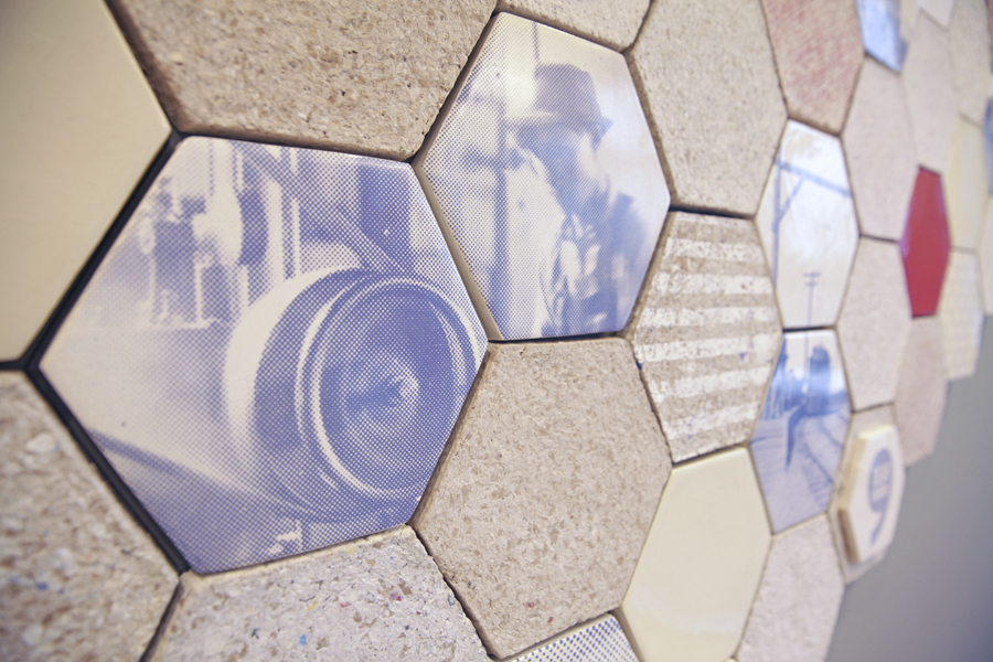 Re-Mapping an Island: Year: 2014
Materials: Moulded recycled paper, custom decals and ceramic tiles
We designed this mural for Vancity's new branch 88 in the abstracted form of the two islands that comprise the city of Richmond. The paper tiles for this project were made entirely from Vancity's recycled internal paper waste. On close inspection of the tiles, bits of Vancity's branding can still be made out. The accompanying ceramic tiles feature reworked blue and white images of Richmond's industrial roots and landmarks. Images curtesy of the Vancouver Public Library and the Richmond City Archives. The white X represents the location on the map of the new branch. Photos by Michael Sider Re-Mapping an Island: Year: 2014
Materials: Moulded recycled paper, custom decals and ceramic tiles
We designed this mural for Vancity's new branch 88 in the abstracted form of the two islands that comprise the city of Richmond. The paper tiles for this project were made entirely from Vancity's recycled internal paper waste. On close inspection of the tiles, bits of Vancity's branding can still be made out. The accompanying ceramic tiles feature reworked blue and white images of Richmond's industrial roots and landmarks. Images curtesy of the Vancouver Public Library and the Richmond City Archives. The white X represents the location on the map of the new branch. Photos by Michael Sider